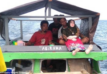 Қуыршақты не үшін  шариғат шәлісімен қымтады?